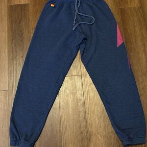 Aviator Nation Navy Sweatpants with Pink lightening bolt Logo.